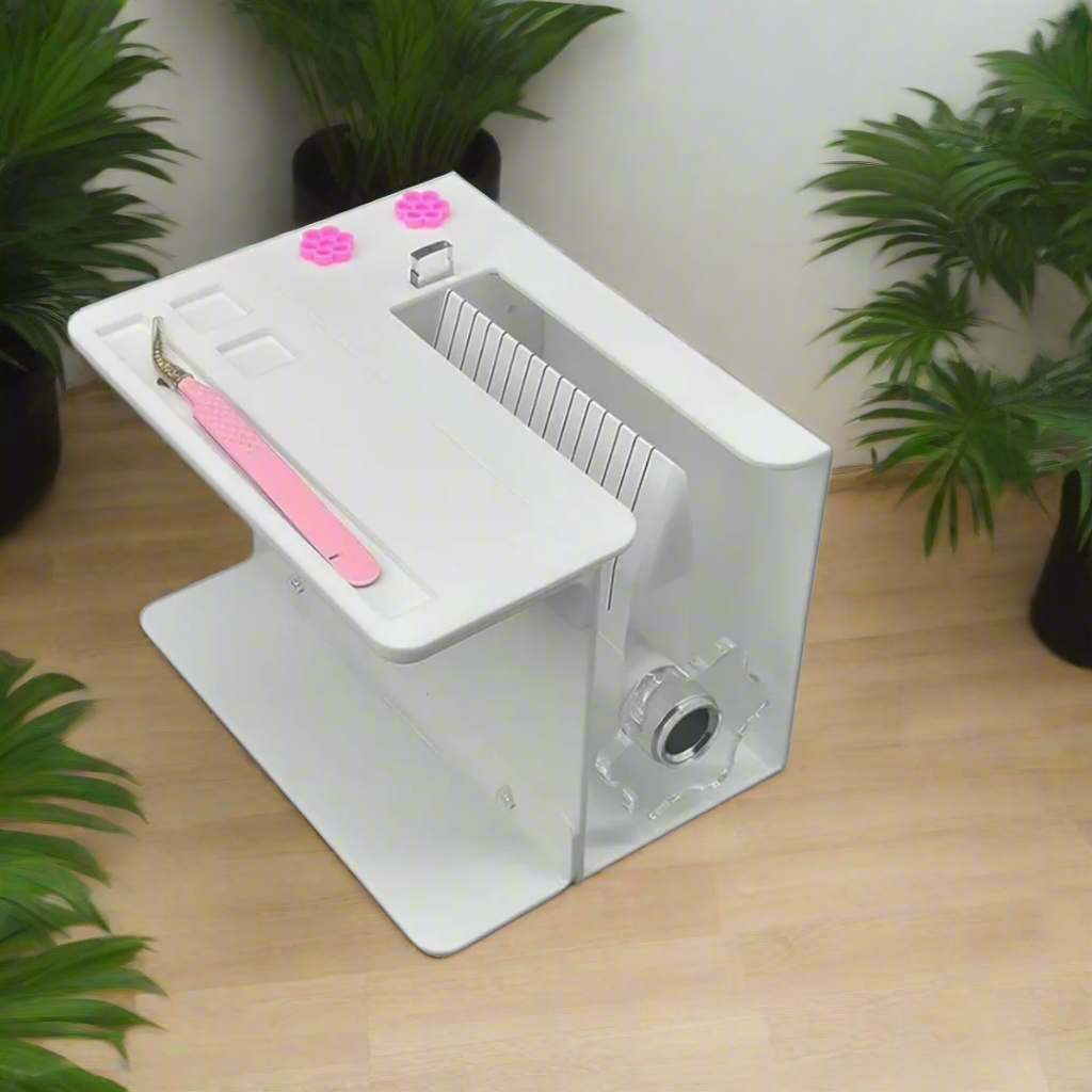 White electronic device with pink components on a clear surface